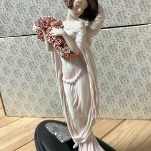 Elegant Pink Porcelain Figurine with Roses